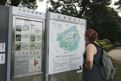 Woman with text on wall