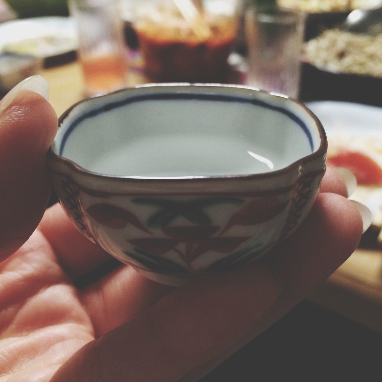 person, holding, part of, indoors, cropped, food and drink, close-up, focus on foreground, unrecognizable person, drink, refreshment, coffee cup, human finger, personal perspective, lifestyles, freshness, coffee - drink