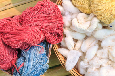 High angle view of threads and cotton on table