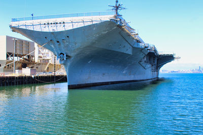 Ship moored on sea against sky