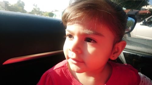 Portrait of cute boy in car