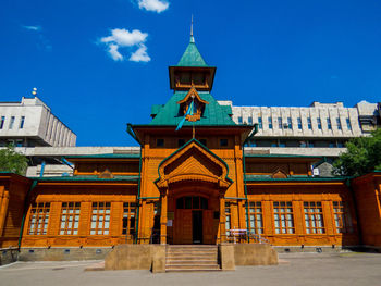 Low angle view of building against blue sky