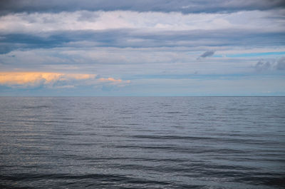 Scenic view of sea against cloudy sky