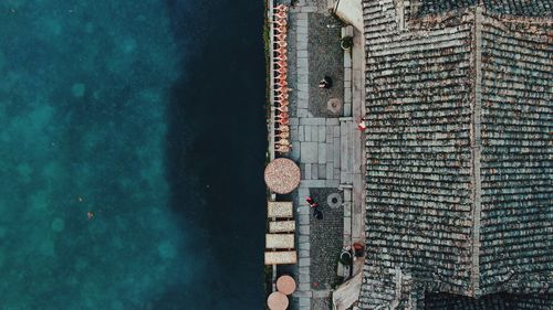 Aerial view of house by sea