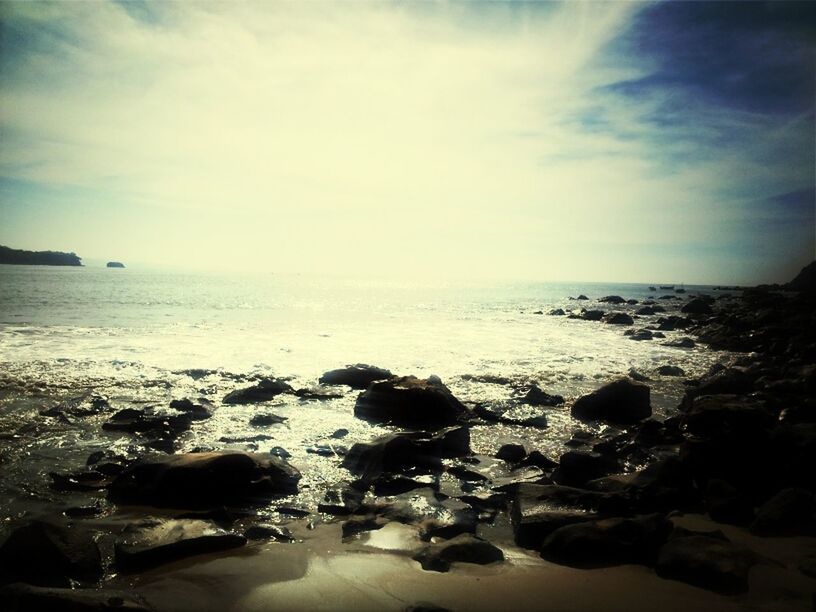 sea, water, horizon over water, beach, sky, rock - object, scenics, shore, beauty in nature, tranquil scene, tranquility, nature, cloud - sky, wave, idyllic, rock, stone - object, rock formation, cloud, surf