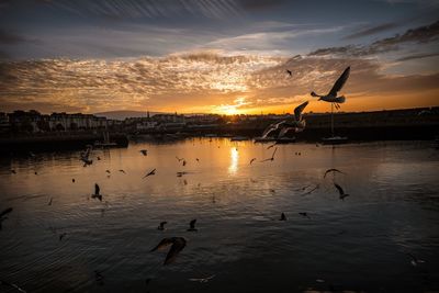 Scenic view of lake against sky during sunset