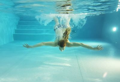 Woman swimming in pool