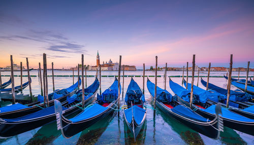 Panoramic view of boats moored in canal