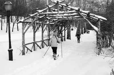 Reflection of trees on snow covered tree in winter