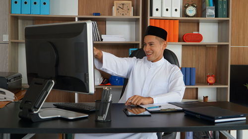 Businesswoman working at desk in office