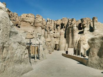 Panoramic view of rock formations against sky