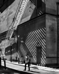 Woman standing in front of building