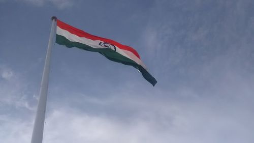 Low angle view of flag against sky