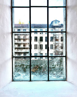 Buildings seen through glass window