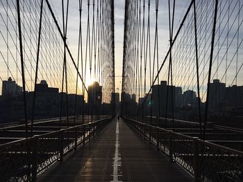 Brooklyn bridge against sky during sunset