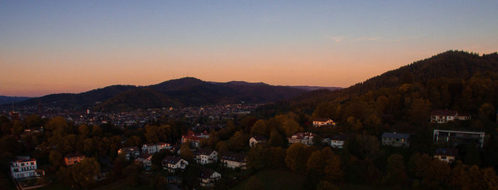 Panoramic view of town against sky during sunset
