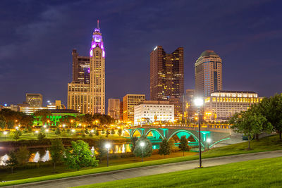 Illuminated buildings in city at night