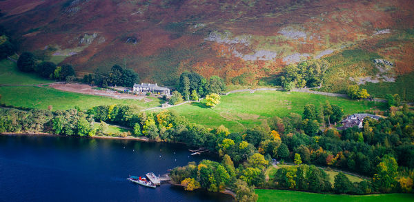 Scenic view of lake amidst trees during autumn