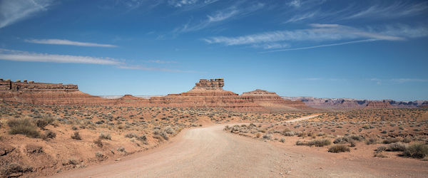 Scenic view of arid landscape against sky