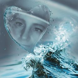 Close-up portrait of a man swimming in sea