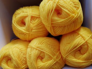 Close-up of yellow wool in box