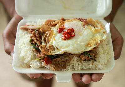 High angle view of person holding food