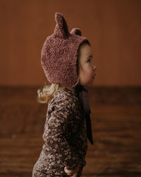 Toddler baby girl in funny hat with ears having fun