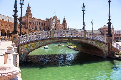 Arch bridge over canal in city