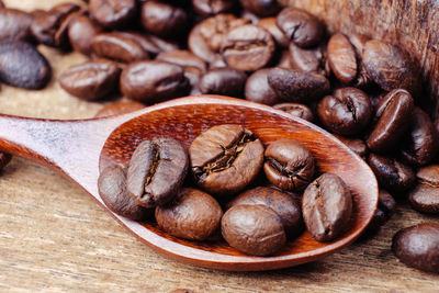 Close-up of roasted coffee beans on table