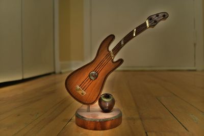 Close-up of guitar on table at home