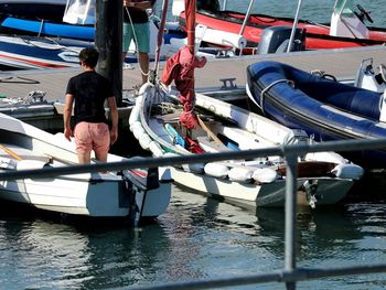 Boats moored at harbor