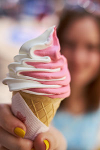 Cropped image of hand holding ice cream cone