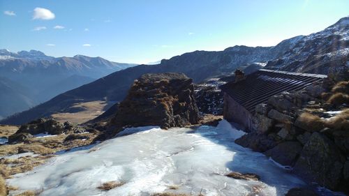 Scenic view of mountains against sky during winter