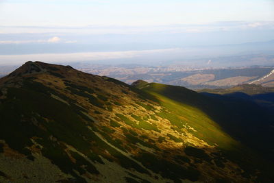 Aerial view of landscape against cloudy sky