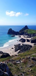 Scenic view of beach against sky. kynance cove 