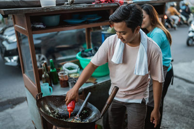 Side view of man working in workshop