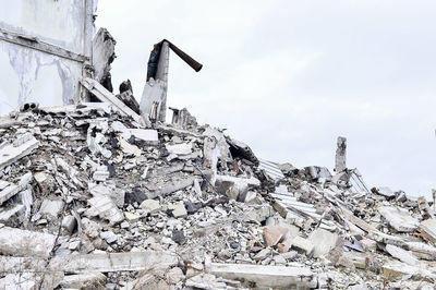 Stack of abandoned house against sky