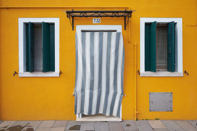 Closed window of yellow door