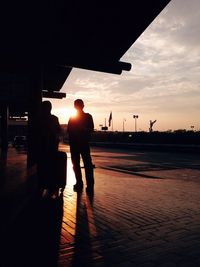 Silhouette of woman at sunset