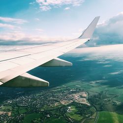 Aerial view of airplane flying over sea