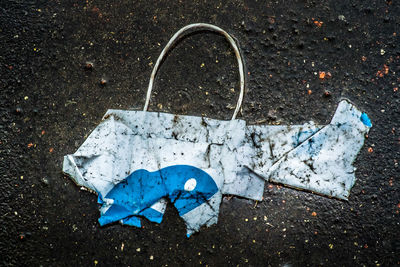 High angle view of garbage on wet land