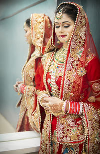 Young bride wearing sari during wedding ceremony