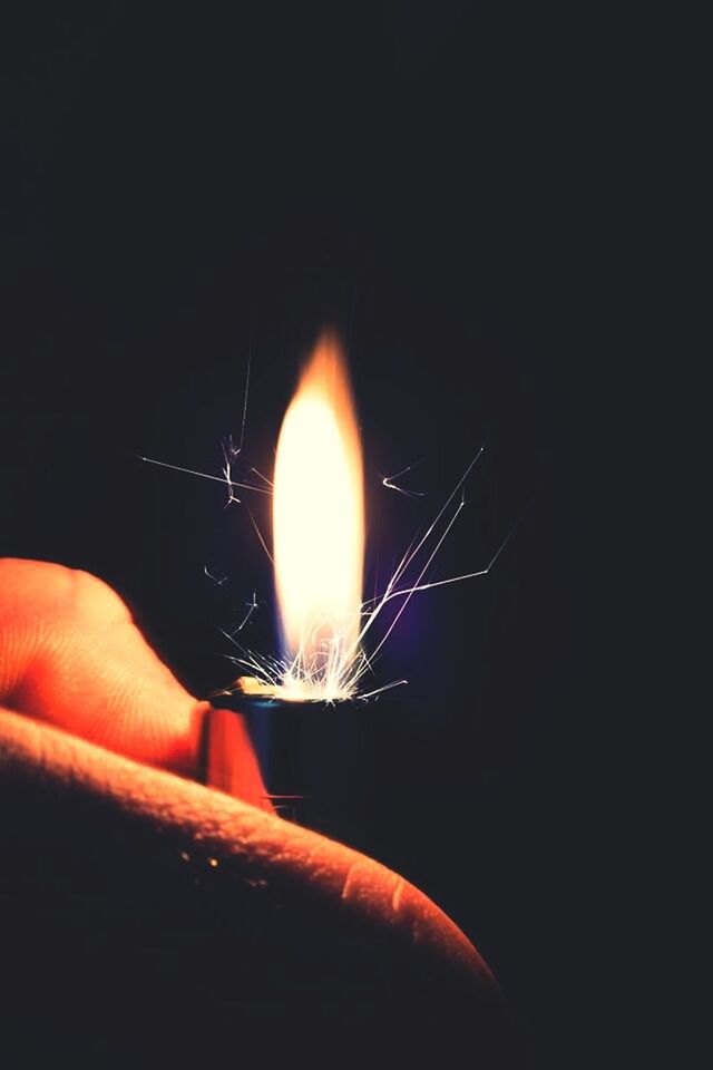 person, part of, illuminated, holding, cropped, copy space, night, human finger, unrecognizable person, close-up, burning, glowing, dark, black background, flame, lit, lifestyles