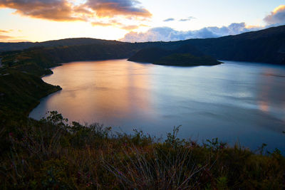 Scenic view of lake against sky during sunset