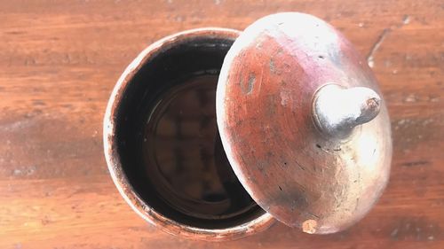 Close-up of rusty machine on table