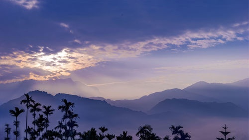 Scenic view of mountains against sky during sunset