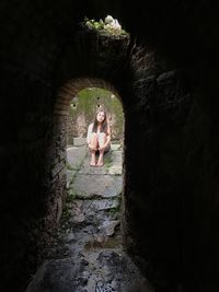 Woman standing in cave