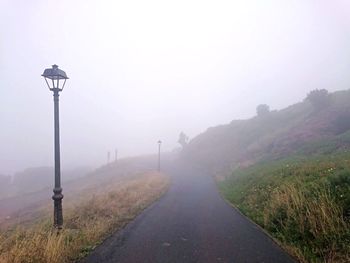 Empty road in foggy weather