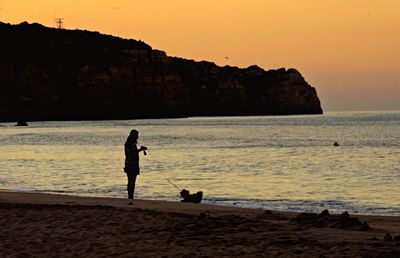 Scenic view of calm sea at sunset