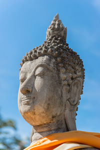 Low angle view of statue against sky